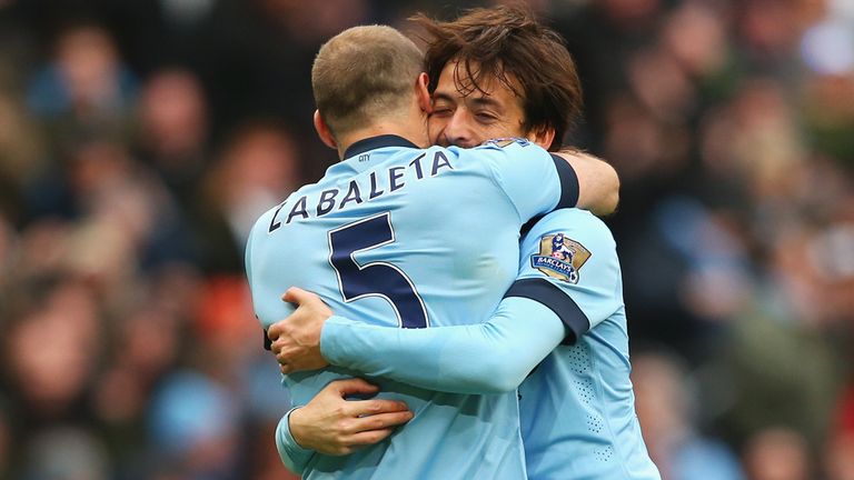 David Silva of Manchester City celebrates the opening goal with Pablo Zabaleta during the Barclays Premier League match