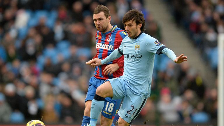 Manchester City's David Silva and Crystal Palace's James McArthur battle for the ball during the Barclays Premier League match at the Etihad Stadium