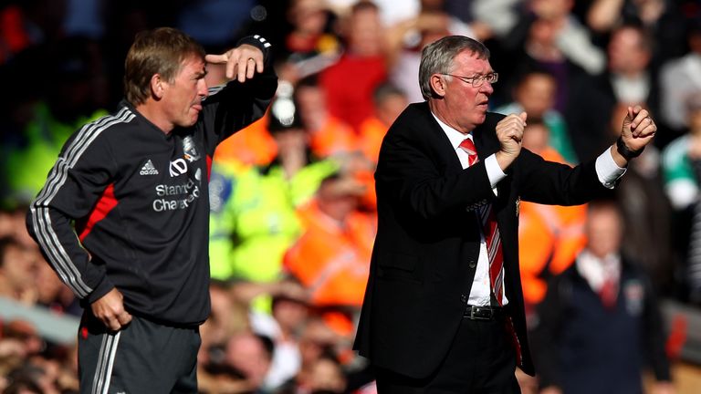 Manchester United manager Sir Alex Ferguson gestures as Liverpool boss Kenny Dalglish looks on 