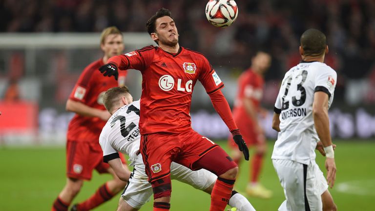 Frankfurt's midfielder Marc Stendera (2nd L) and Leverkusen's Turkish midfielder Hakan Calhanoglu (2nd R) 