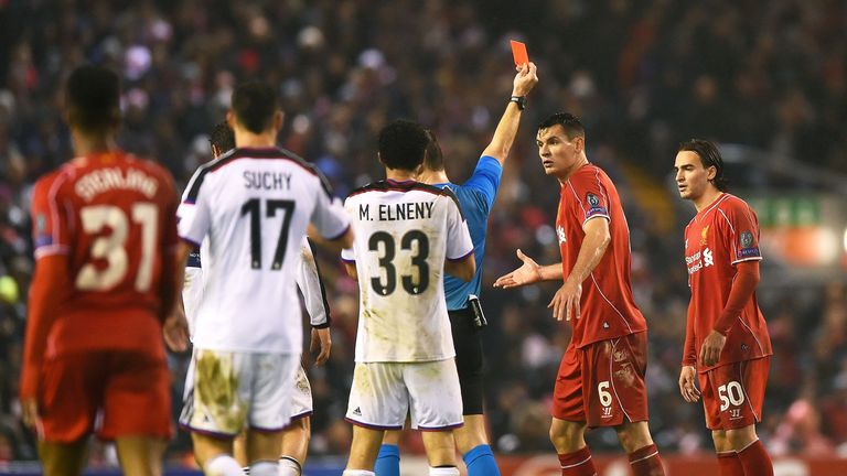 Dejan Lovren of Liverpool reacts as teammate Lazar Markovic is shown the red card card during the Champions League group B draw with FC Basel