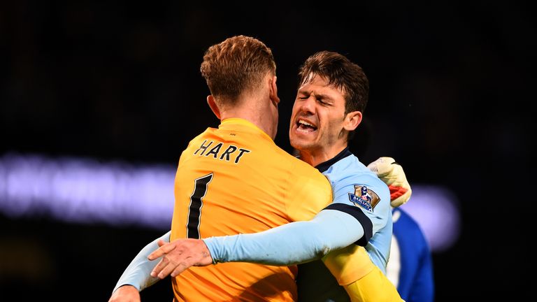 Martin Demichelis of Manchester City celebrates with Joe Hart after victory over Everton in the Barclays Premier League