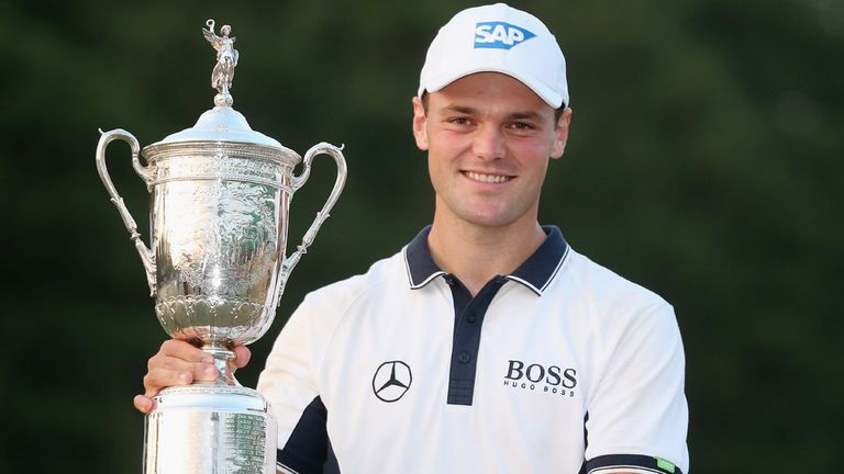  Martin Kaymer of Germany celebrates with the trophy after his eight-stroke victory during the final round of the 114th U.S. Open 