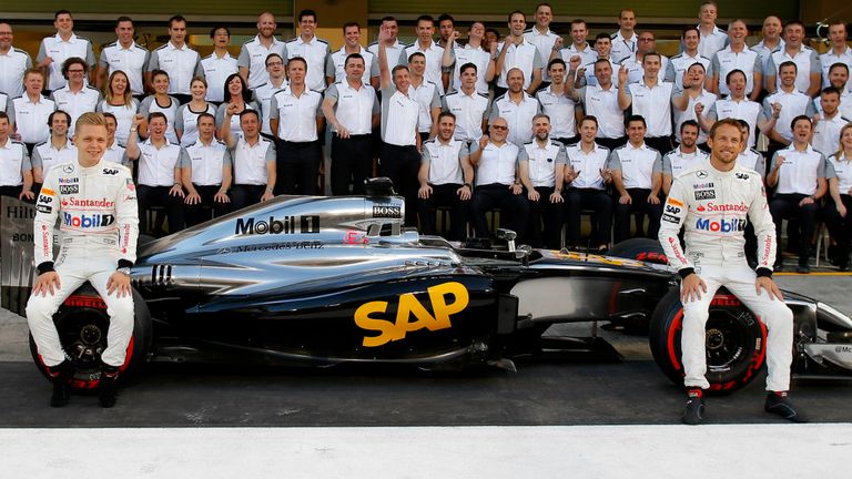 Kevin Magnussen and Jenson Button pose for McLaren's end-of-season photo 