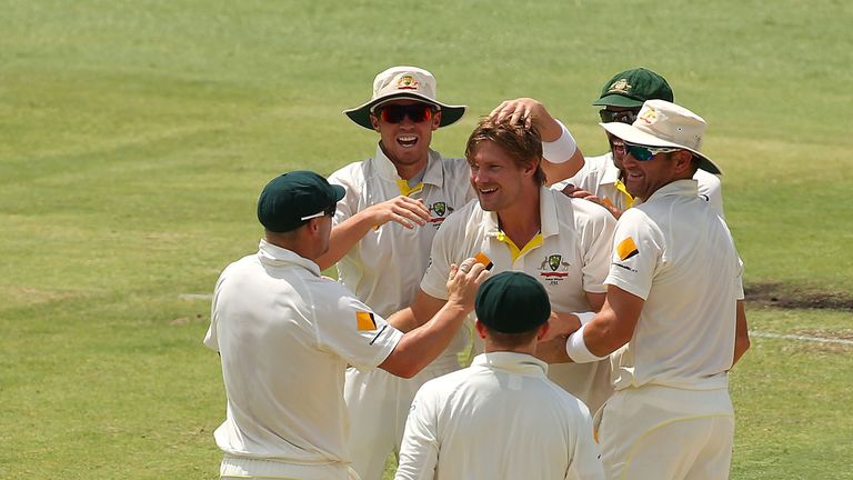 PERTH, AUSTRALIA - DECEMBER 16:  Shane Watson of Australia is congratulated by team mates after dismissing Michael Carberry of England during day four of t