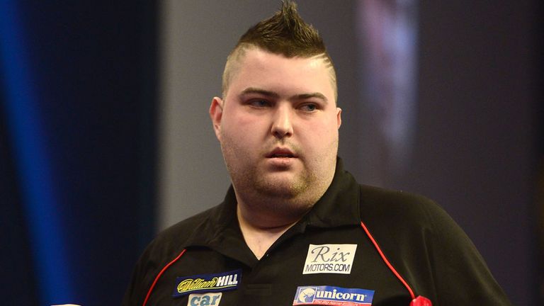 Michael Smith celebrates his win during the William Hill World Darts Championship at Alexandra Palace, London.