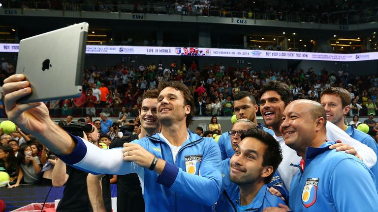 Carlos Moya of the Manila Mavericks takes a team selfie after their victory over the Singapore Slammers