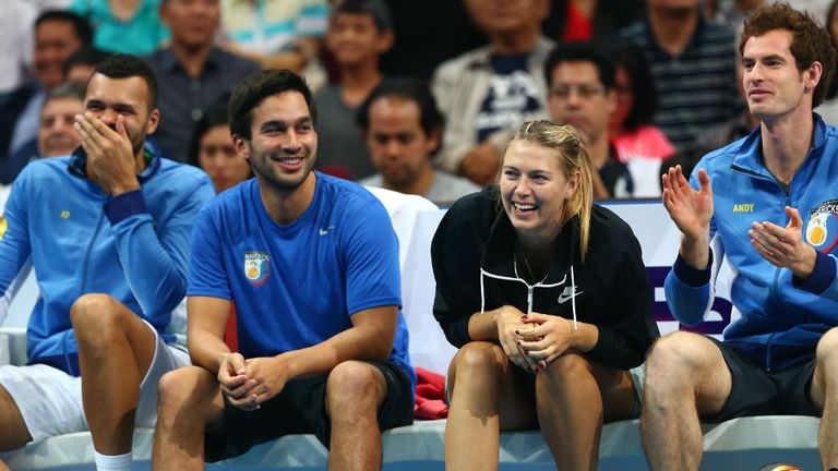 Maria Sharapova and Andy Murray of the Manila Mavericks share a joke whilst sitting on the team bench