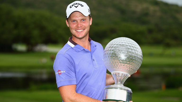 SUN CITY, SOUTH AFRICA - DECEMBER 07:  Danny Willett of England poses with the trophy after securing victory during the final round of the Nedbank Golf