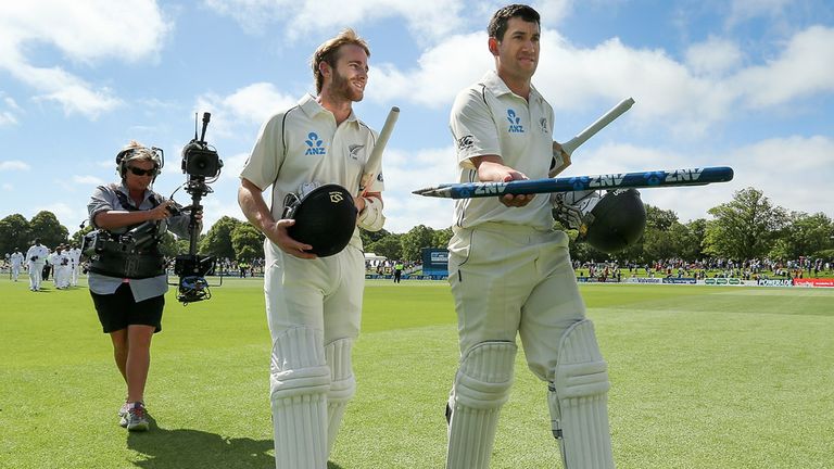 Kane Williamson (l) and Ross Taylor walk off the field after leading New Zealand to an eight-wicket victory over Sri Lanka in Christchurch