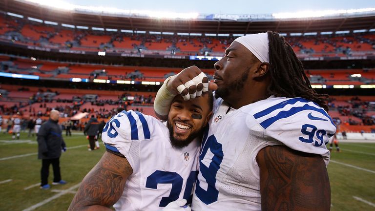 Dan Herron and Ricky Jean Francois celebrate Indianapolis' narrow win over the Browns.