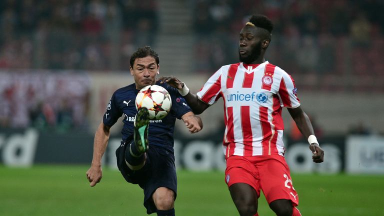 Olympiakos' French defender Eric Abidal (R)  vies with Malmo's defender Matias Concha