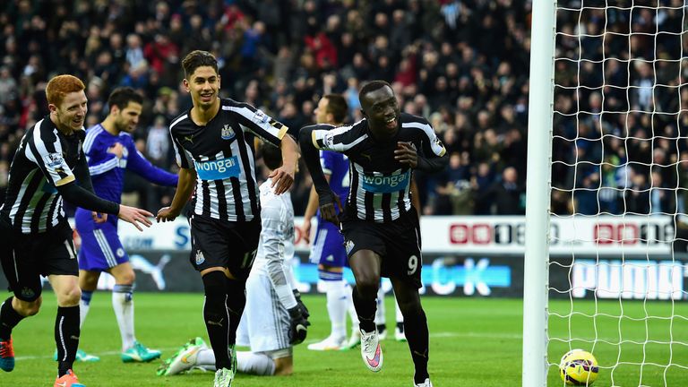 NEWCASTLE UPON TYNE, ENGLAND - DECEMBER 06:  Papiss Cisse of Newcastle (r) celebrates after scoring the opening goal during the Barclays Premier League mat