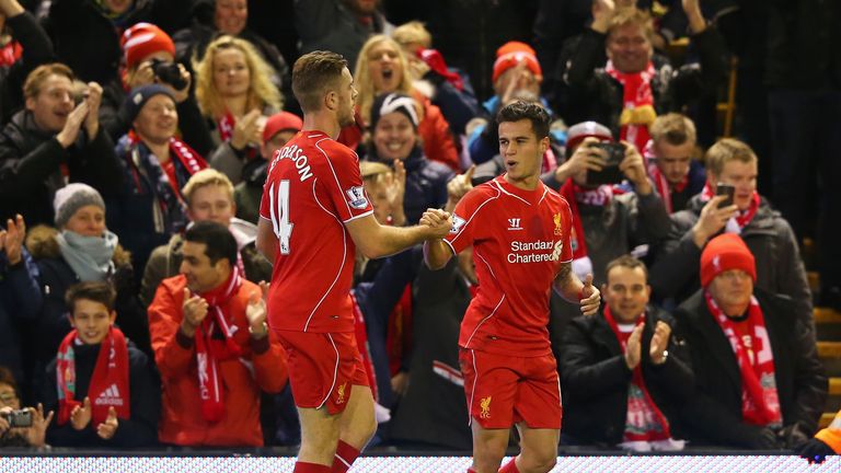 LIVERPOOL, ENGLAND - DECEMBER 21:  Philippe Coutinho (R) of Liverpool celebrates his goal with Jordan Henderson of Liverpool during the Barclays Premier Le