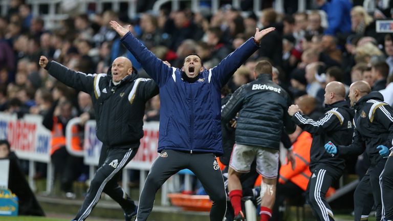 Gus Poyet (C) reacts to Adam Johnson's late winner during the  match between Newcastle United and Sunderland