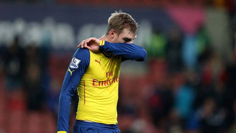 STOKE ON TRENT, ENGLAND - DECEMBER 06:  Per Mertesacker of Arsenal looks dejected at the end of the Barclays Premier League match between Stoke City and Ar