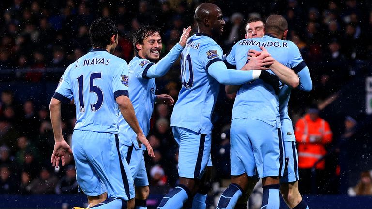  Fernando of Manchester City celebrates with team-mates after scoring the opening goal