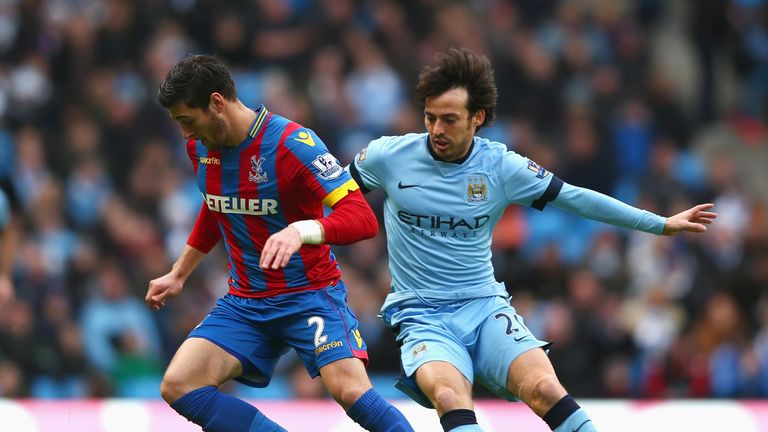 MANCHESTER, ENGLAND - DECEMBER 20: Joel Ward of Crystal Palace is closed down by David Silva of Manchester City during the Barclays Premier League match be