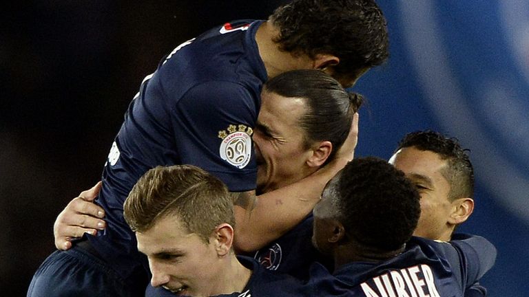 Paris Saint-Germain's Swedish forward Zlatan Ibrahimovic (C) celebrates with teammates after scoring a second 