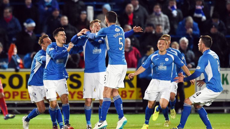 Queen of the South's Kevin Holt (centre) celebrates with team-mates after putting his side 1-0 up against Rangers