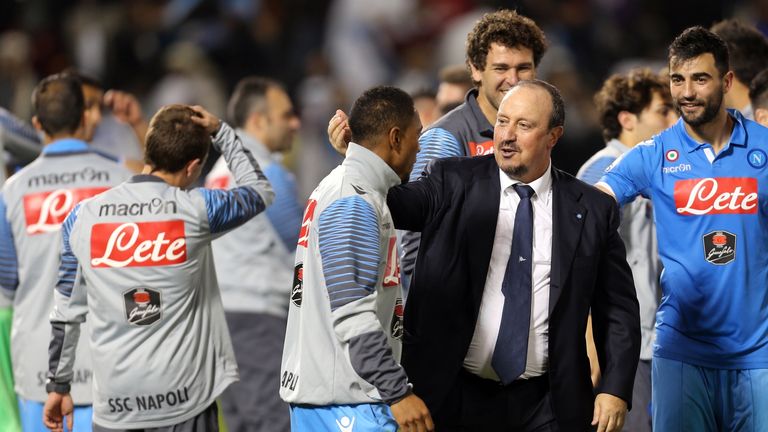 Napoli's Spanish manager Rafa Benitez (C-R) congratulates his players after winning the penalty shoot-out during the Italian Super Cup against Juventus FC