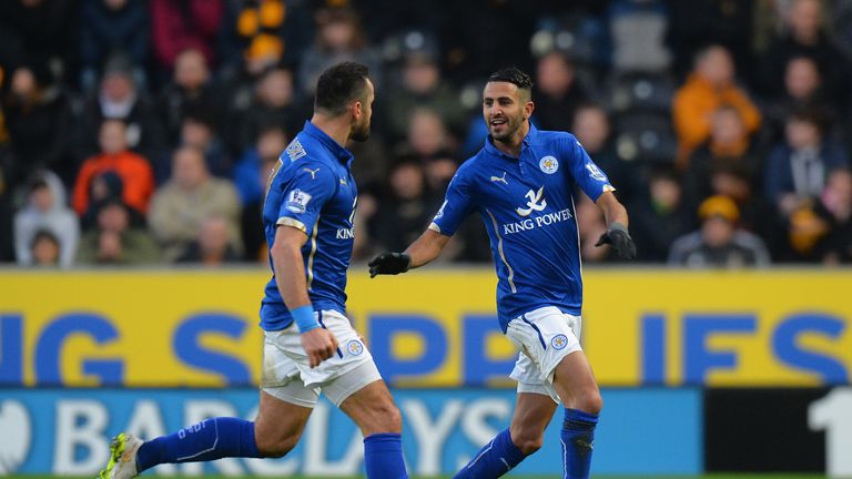 HULL, ENGLAND - DECEMBER 28:  Riyad Mahrez of Leicester City celebrates scoring the opening goal with Marcin Wasilewski of Leicester City during the Barcla