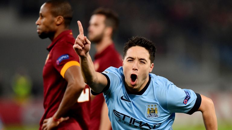 Samir Nasri netted as Manchester City reached the last 16 of the Champions League with victory at Roma