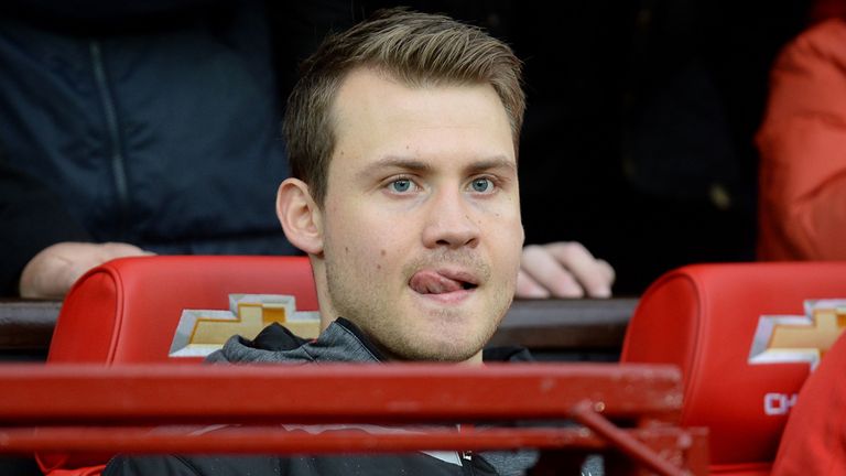 Liverpool goalkeeper Simon Mignolet sits on the bench 