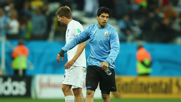 Luis Suarez of Uruguay speaks to Steven Gerrard of England after Uruguay's 2-1 victory in the 2014 FIFA World Cup