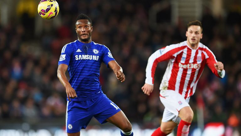  John Obi Mikel of Chelsea  is watched by Marko Arnautovic of Stoke City during the Barclays Premier League match