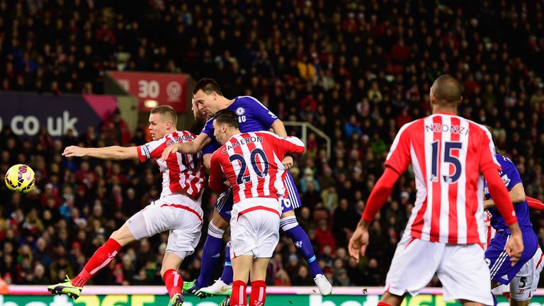 Chelsea player John Terry (c) heads in the opening goal during the Barclays Premier League match between Stoke City and Chelsea