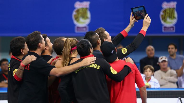 DUBAI, UNITED ARAB EMIRATES - DECEMBER 13: Tomas Berdych of the Singapore Slammers takes the final group selfie after his teams last match against the Mani