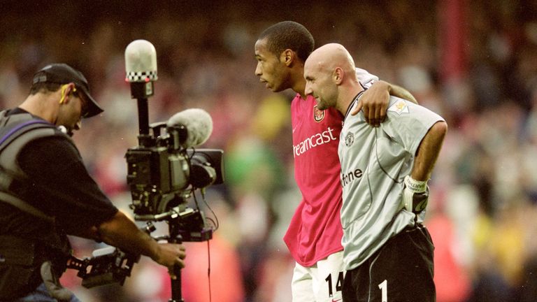 1 Oct 2000:  Thierry Henry of Arsenal puts his arm around Fabien Barthez of Manchester United during the FA Carling Premiership match at Highbury