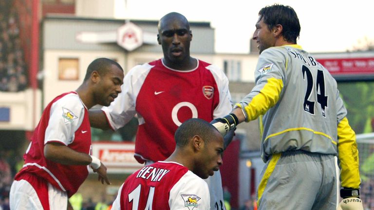 Arsenal's Thierry Henry is congratulated by team-mates from left Ashley Cole, Sol Campbell and Rami Shaaban after scoring against Tottenham in Nov 2002
