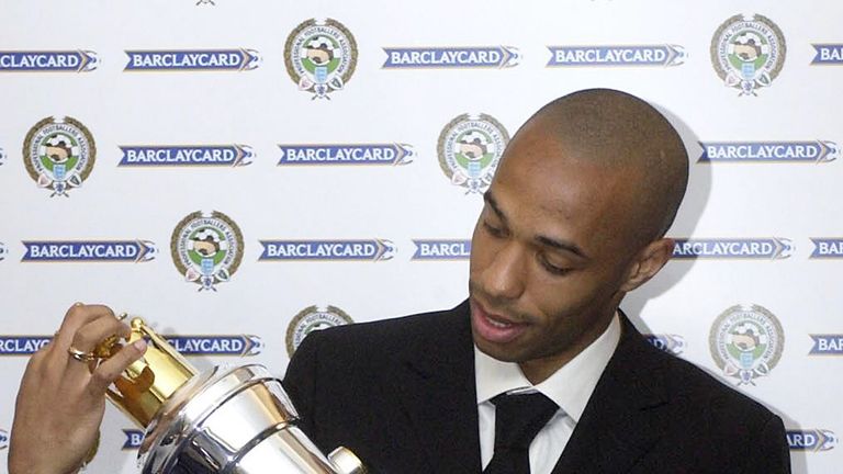 Henry poses with the Players' Player of the Year Award after Arsenal's 2003/4 'Invincibles' season.