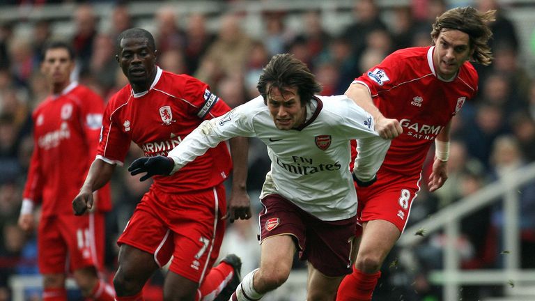 Arsenal's Tomas Rosicky (C) is tackled by Middlesbrough's George Boeteng (L) and Middlesbrough's Jonathan Woodgate during their English Premiership 