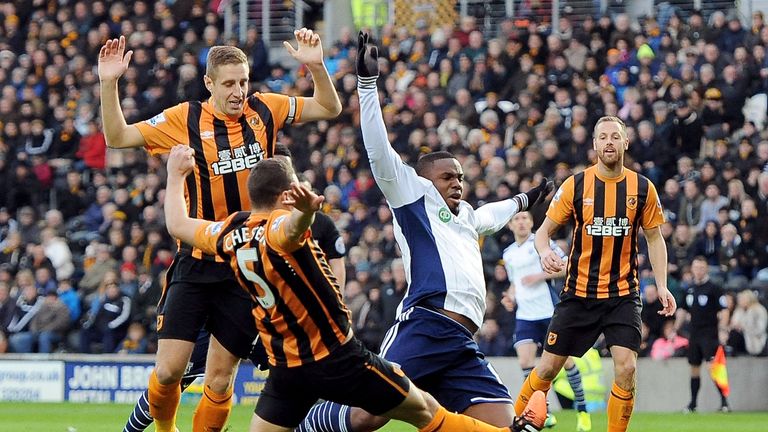 Victor Anichebe of West Brom, James Chester of Hull City and Michael Dawson of Hull City match between Hull City and West Bromwich Albion at the KC Stadium