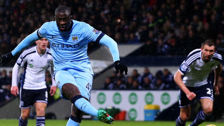  Yaya Toure of Manchester City scores his team's second goal from the penalty spot