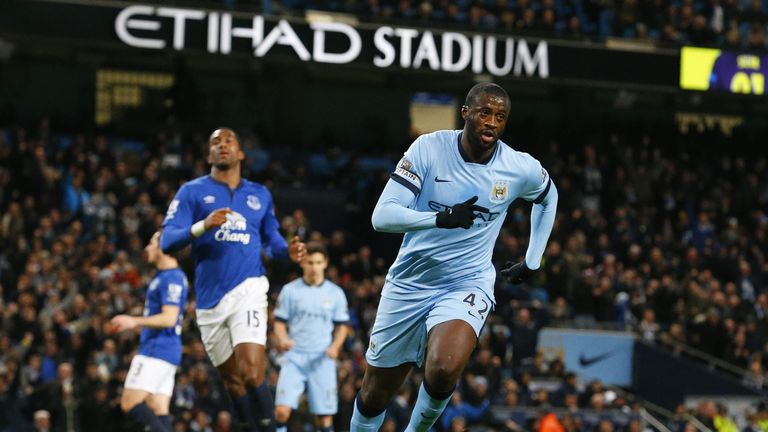 Manchester City midfielder Yaya Toure celebrates scoring the opening goal from a penalty during the Premier League football match v Everton at the Etihad