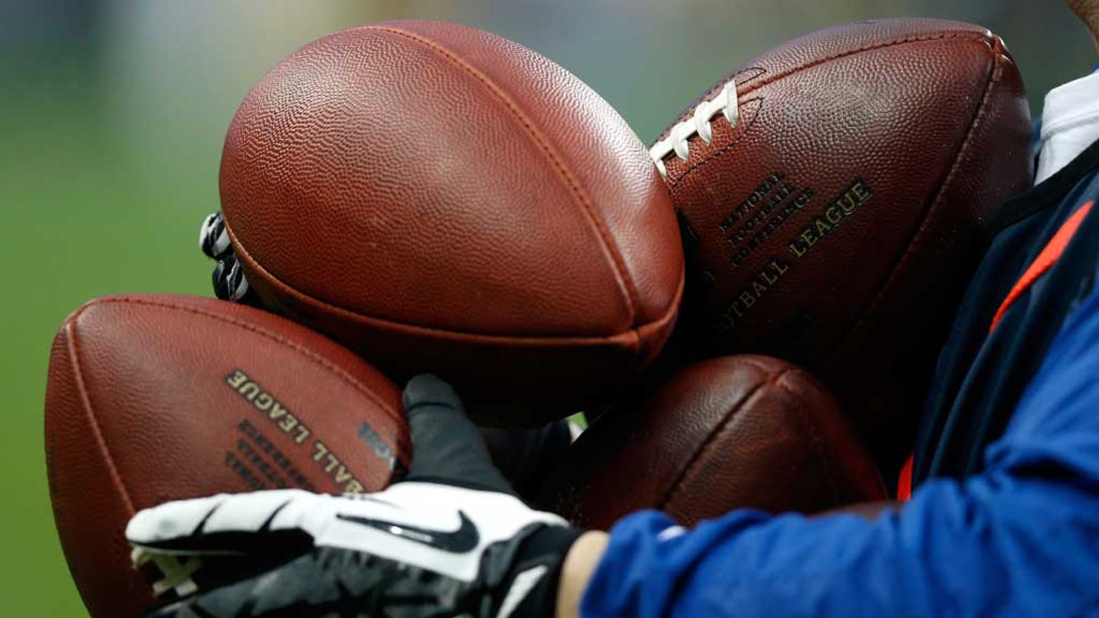 Other sports. Holding Football.