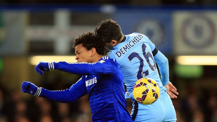 Chelsea's Loic Remy (left) jumps for the ball with Manchester City's Martin Demichelis during the Barclays Premier League match at Stamford Bridge, London