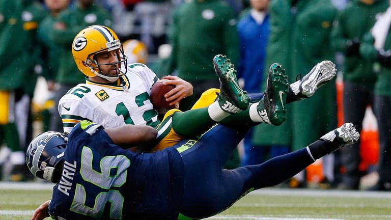 SEATTLE, WA - JANUARY 18: Cliff Avril #56 of the Seattle Seahawks sacks Aaron Rodgers #12 of the Green Bay Packers during the third quarter of the 2015 NFC