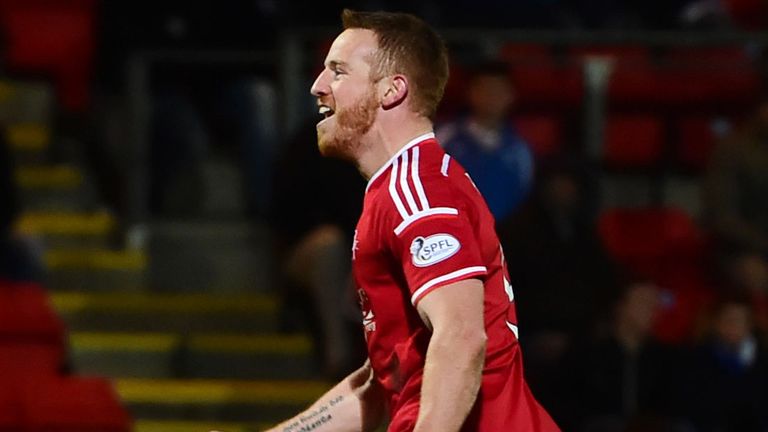 Aberdeen's Adam Rooney celebrates having pulled back a goal for his side 1-1 against St Johnstone