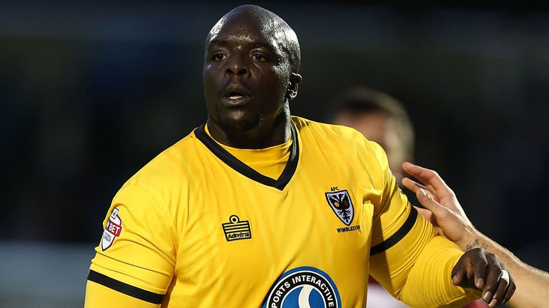 The solidly built Adebayo Akinfenwa is looking forward to facing the team he supported as a boy when AFC Wimbledon entertain Liverpool in the cup on Monday