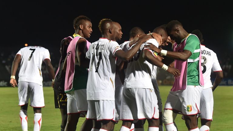 Mali forward Modibo Maiga is congratulated by teammates after scoring a goal against Guinea on January 28, 2015. 