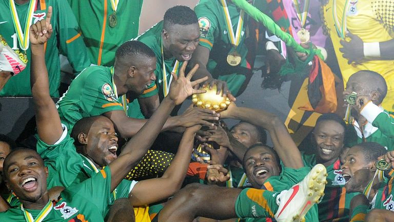 Zambia's national team players celebrate their victory with their trophy at the end of the African Cup of Nations final in 2012