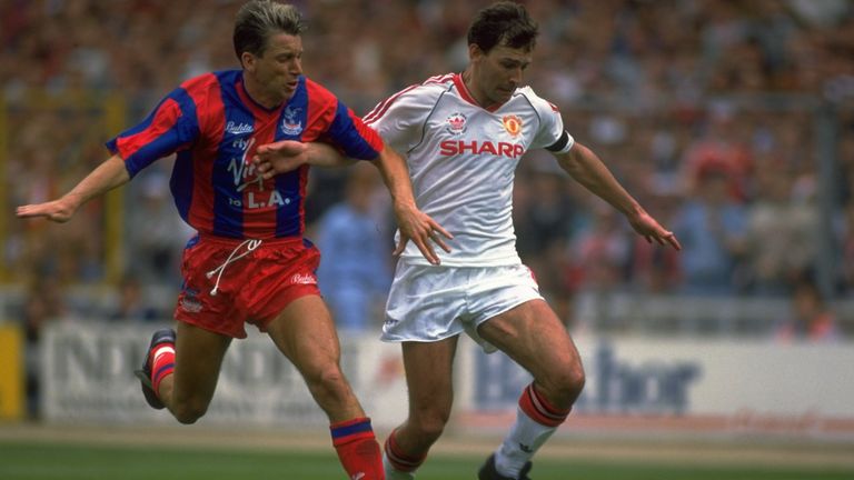 1990:  Bryan Robson (right) of Manchester United holds off Alan Pardew (left) of Crystal Palace during the FA Cup final at Wembley Stadium in London. The m