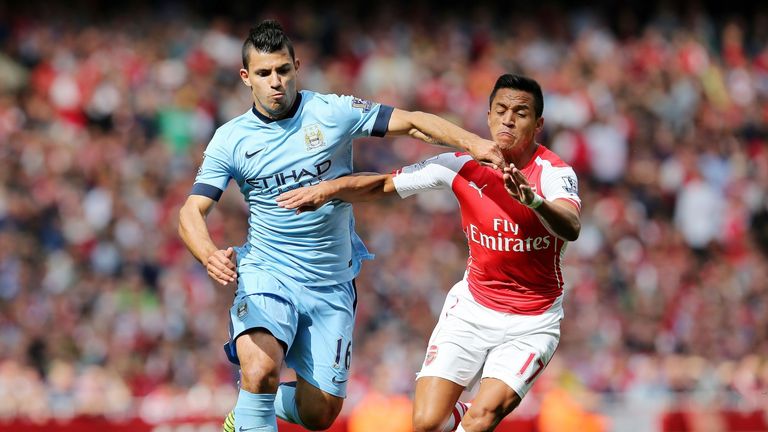 Manchester City's Sergio Aguero (left) is challenged by Arsenal's Alexis Sanchez at the Emirates