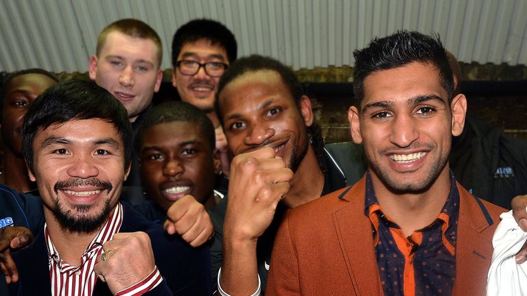 Amir Khan and Manny Pacquiao pose for the media at Fitzroy Lodge Amateur Boxing Club, London. PRESS ASSOCIATION Photo. Picture date: Friday January 23, 201