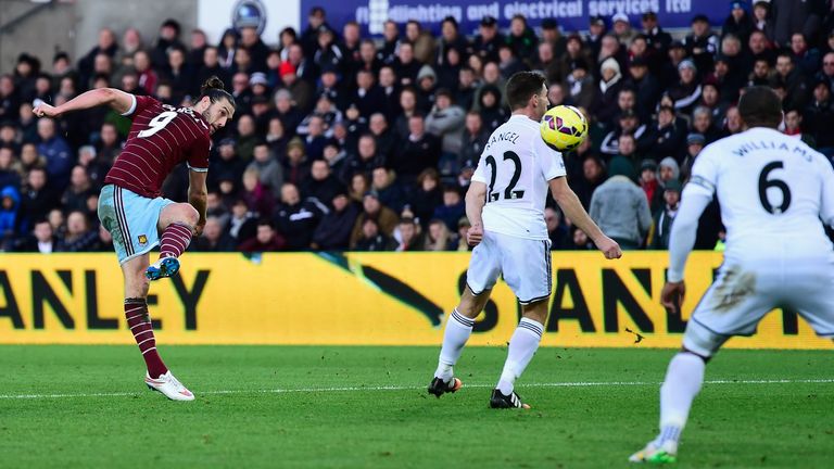West Ham United player Andy Carroll shoots to score a spectacular opening goal against Swansea
